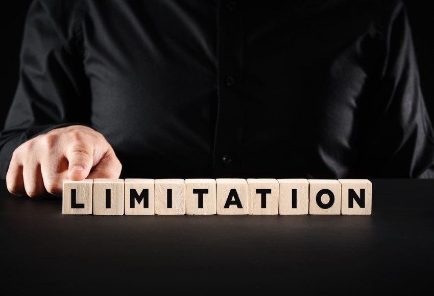 Man Holding Finger On Row Of Wooden Cubes Bearing The Word Limitation Reference To Limitations Of Tarot Reading